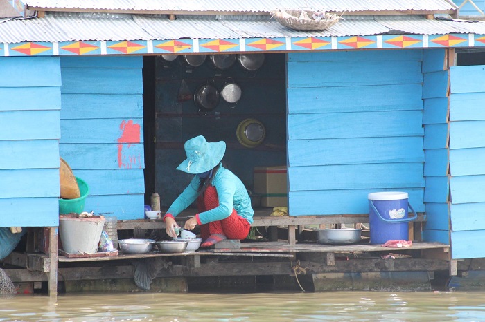 This picture was taken at the floating village of Tonle Sap, Cambodia. The blue background enhanced by the blue outfit of the local resident . Pic by: Alpa Gandhi 